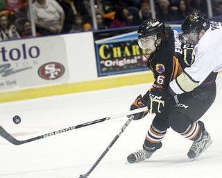 William D Lewis The Vindicator Phantoms Zach Evancho(16) and Lumberjacks Mike Preston(7) go for the puck during 2-23-13 game with Lumberjacks.