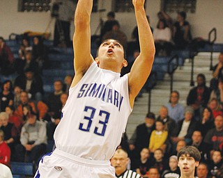 Poland’s George Chammas puts in a layup in Friday’s game against Girard. The Bulldogs earned the top seed in
Division II of the Boardman District.