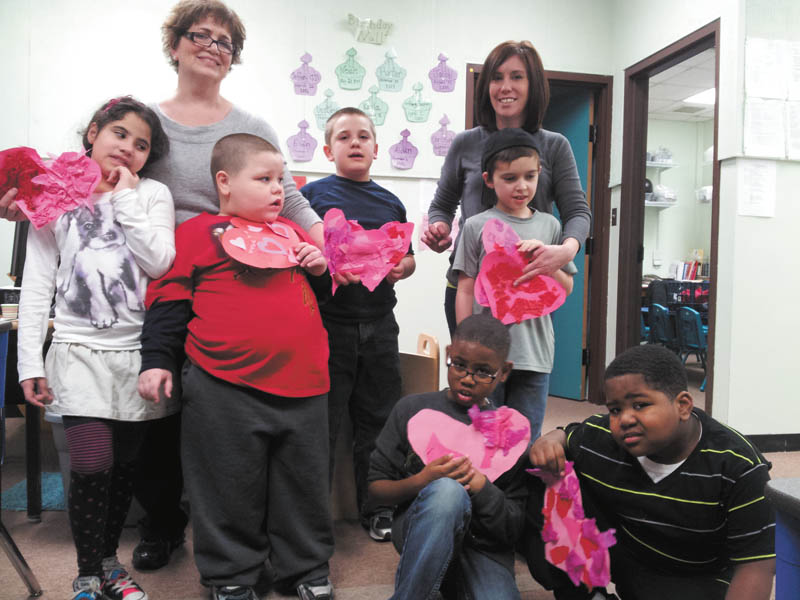 Ten children in first grade at the Rich Center for Autism made valentines out of tissue paper and stickers that were presented by their teachers to residents at Park Vista. The students also visited Park Vista. Two of the teachers are, from left, Grace Naji and Beth Maurice. The children pictured standing are Destiny Lopez, left, J.J. Juhasz, Hunter Gonzales and Christopher Roberts, and kneeling are A.J. Walton and Eian Mason.
