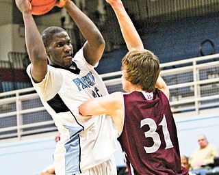 East’s Jalen Hooper (4) shoots over Boardman’s Austin Downie (31) during the Panthers’ win at Alliance High. East advances to meet Warren Harding.