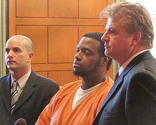 Attorneys David Rouzzo, left, and Matt Pentz of the Ohio Public Defender’s Office stand with Melvin Turner during sentencing in court Tuesday.