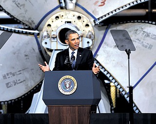 Standing in front of a ship propeller, President Barack Obama speaks about automatic defense-budget cuts on Tuesday at Newport News Shipbuilding in Newport News, Va.