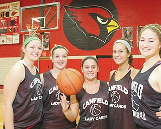 The Canfield girls basketball team — led by seniors, from left, Kayla Barko, Abby Baker Paige Baker, Allie Pavlansky and Sabrina Magapora — is ready to face Struthers today in a Division II district semifinal at Austintown High School.