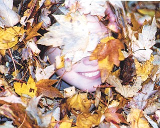 Leanna Hartsough in the leaves. Photo sent in by Lana VanAuker of Canfield.