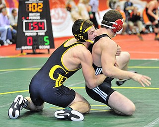 Crestview's Matt Hardenbrook controls the back of Mohawk's Grant Price during their 170lb bout.