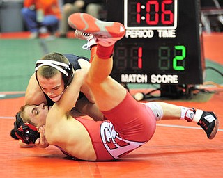 Beaver Local's Jason Keyes tries to avoid being pinned by St. Paris Graham Local's Brent Moore.