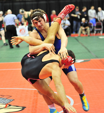 Poland's Mike Audi takes down New Philadelphia's Mike Barrow.