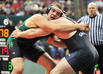 West Branch's Logan Sharp grapples with Carrollton's Austin Bentley.