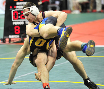 Boardman's Joe Cordova goes for the takedown of Lewis Center Olentangy's Nate Hall.