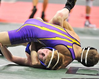 Poland's Dante Ginnetti attempts to avoid being pinned by Eaton's Michael May.
