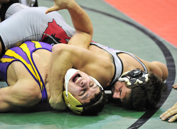 Canfield's John Poullas attempts to pin Eaton's Tyler Claybaker.