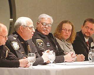 These panelists talked about tools to handle life-and-death situations at Mr. Anthony’s Banquet Center
in Boardman on Thursday. From left, Sgt. Ken Goist, school-resource officer with Springfield schools; police
Chief Vincent D’Egidio of New Middletown; Michael Cretella, deputy chief of YSU Police; Jessica Jaros, disaster supervisor with Red Cross; and Steve Ruggles, operations director for Master Security Inc.