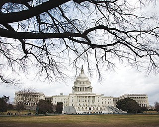 The U.S. Capitol is seen in Washington. After months of dire warnings about the across-the-board spending cuts, the $85 billion budget trigger didn’t spell doom. On talk shows Sunday, neither Republicans nor Democrats hinted at a tangible proposal for rolling back those cuts, yet Republicans and Democrats have pledged to retroactively undo the cuts.