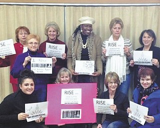 SPECIAL TO THE VINDICATOR
Feb. 14 was observed as the National Day of Action with one billion people working to end violence against women in communities, nationally and globally. Members of Trumbull County Democratic Women’s Caucus participating were, in front from left, Gina Bianco, Kathy DiCristofaro, Julie King and Roz Gadd; and in back, Carolyn Furrie, Alma Griffth, Diane Alejars, Helen Rucker, Sue Gatta and Laurie Gibson.