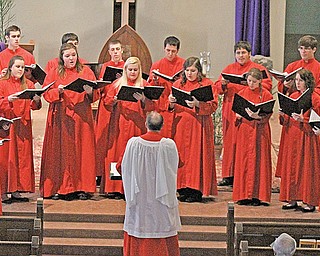 Members of the Salem Youth Chorus, directed by Jon Simsic, perform a selection during the concert Sunday at St. Brendan Church in Youngstown. The group is presenting a series of concerts featuring reflective music for Lent.