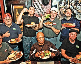 Anthony Fuda, AC McCullough, Scott Long, seated from left, and John Spatar, Eric Clark, Jerry Tranovich, and Eric Tranovich at Trax Restaurant & Lounge in Austintown.
