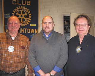 SPECIAL TO THE VINDICATOR
Josh Joki, center, regional director of the Siffrin Group on Westchester Drive in Austintown, was recently inducted by Chuck Baker Jr., left, as the newest member of the Rotary Club of Austintown. On the right is Ron Carroll, president. Joki is an Austintown resident and father of five. He commented that the variety of activities done by Rotary was his inspiration for joining. In other business, long-time member Frank Santisi became the newest honorary member of the club. He is a past president and active member in many aspects of the organization.