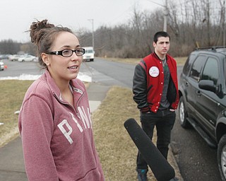 Candice Smith, a sophomore at Canfield High School, and Tom Colucci, a senior, talk about the school evacuation because of a bomb threat. A handwritten note was found Thursday morning, prompting the district and Canfield police to close the school and search for a bomb.