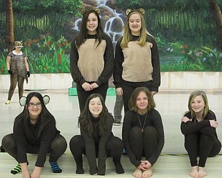 Neighbors | Natalie Scott.Monkeys from the Austintown Middle School production of "The Jungle Book" hung around together during rehearsal Feb. 22.