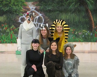 Neighbors | Natalie Scott.A group of students show off their costumes for the middle school production of "The Jungle Book" during rehearsal Feb. 22.