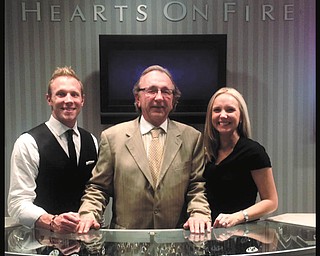 SPECIAL TO THE VINDICATOR
The Komara family will be recognized for their efforts in supporting the Alzheimer’s Association at the Forget-Me-Not Gala April 13 at Tippecanoe Country Club in Canfield. Pictured are Bob Komara, center, who heads Komara Jewelers, and his children, Bob Komara and Briana Komara Pridon, who are managers at local Komara stores.