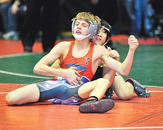 Matthew Cardello of Poland, representing the North Akron Wrestling Club, works on controlling the Burnett Trained Wrestling Club’s Hunter Kosco during their semifinal match Sunday in the 96-pound weight division of the 15th annual Ohio Junior High State Wrestling Tournament at the Covelli Centre. Cardello defeated Kosco in a 6-4 decision, but fell 3-2 in the championship bout to Tanner Smith for his only defeat of the weekend and to 
finish as runner-up.