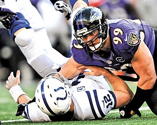 Baltimore Ravens outside linebacker Paul Kruger (99) sacks Indianapolis Colts quarterback Andrew Luck (12) during the second half of a wild-card playoff game in Baltimore. Kruger agreed to terms Tuesday on a contract with the Cleveland Browns.