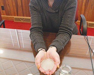 Lisa R Wallace - COO of Buckeye Transfer Realty , holds one of the three types of fracking sands.