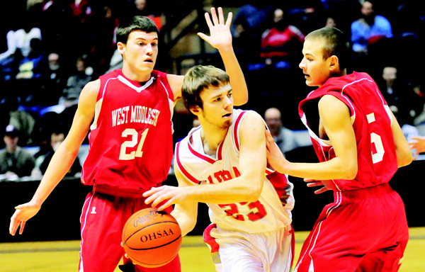 LaBrae senior John Richards (23) looks to pass while West Middlesex’s Jerrod Palmer (5) and Jeremy Jansco (21) defend during a Jan. 20 basketball game at the Covelli Centre. LaBrae will play in the Division III state semifinals on Thursday in Columbus.