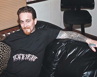 The Youngstown Planning Commission voted 3-1 not to grant a waiver to Lance Peck, who wants to open a tattoo parlor downtown at 101 W. Federal St., the location of the former William Leonard’s Extraordinary Spa and Salon. Peck currently operates a tattoo parlor in Austintown. Above, Peck shows some of his drawings.