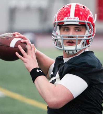 Youngstown State quarterback Kurt Hess looks downfield during a passing drill Tuesday. The workout was the first of the spring for YSU.