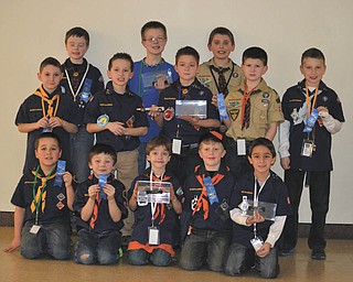 Cub Scout Pack 4050 from Cortland recently held its annual Pinewood Derby at the Optimist Club’s Candlelite Knolls. Forty-six Scouts from 5 to 12 years old participated. The top three racers from each den advance to the Pack 4050 Championship Pinewood Derby April 27 at Eastwood Mall in Niles. Each pack in the Arrowhead District is invited to send the top three racers from each of their Dens to compete in the championship. For information visit Pack 4050.com. Pictured are Cub Scout 4050 Den winners, kneeling from left, Dakota Tolley, Wolves Den, second place; Gavin Dodrill, Tigers Den, second place; Sam Harper, Tigers, first place; Adien Johnson, Tigers, third place; and Cade Cratsley, Bears Den, third place; in the middle row are Nathan Driscoll, Wolves, third place; Evan Lenox, Bears, first place; Hunter Picuri, Webelos 1, first place; Ian Garcia, Webelos I, third place; and Evan Davies, Bears, second place; in back are Nathan Woofter, Webelos II, second place; Ethan Toot, Webelos II, first place; and Jon Grimm, Webelos I, second place. Pack winners, below, are Derek Sandor, left, third place; Hunter Picuri, first place; and Ian Garcia, second place; with their leaders, Tim Grimm and Tim Sandor.