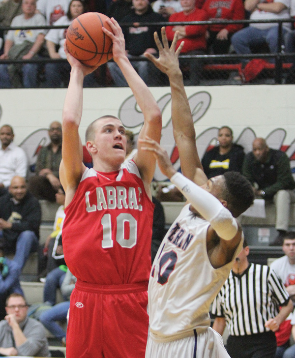 Today’s Division III state semifinal high school basketball game in Columbus is slated to be the battle between two big men with college futures: LaBrae’s 6-foot-7 Peyton Aldridge (10), above, and Versailles’ 6-foot-5 Kyle Ahrens.