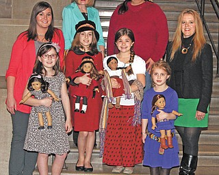 NICK MAYS | THE VINDICATOR
The American Girl Fashion Show sponsored by Akron Children’s Hospital Mahoning Valley will be April 20 and 21 at Stambaugh Auditorium, Youngstown. Shows will be at 11 a.m. and 3 p.m. each day. Committee members and models preparing for the event in front from left are, Zoe Simon, Andrea Dull, Gabriella Calderon and Paige Fluent. In back are Allison Engstrom, Akron Children’s Hospital development assistant; Betty Cmil, American Girl Committee Co-chairwoman; Amber Gallo, show coordinator; and Shirley Smith-Fluent.