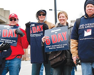Local United States Postal Service employees demonstrate at the main post office in downtown Youngstown to have Congress overrule a U.S. Postal Service decision to end Saturday mail delivery.