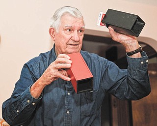 Bob Filips shows off some of his magic tricks. He has belonged to the Youngstown Magic Club since he was 15. 