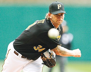 Pittsburgh Pirates starting pitcher A.J. Burnett warms up before the first inning of Monday’s season opener against the Chicago Cubs at PNC Park. The Cubs won, 3-1. Burnett struck out 10 in 5 2⁄3 innings.