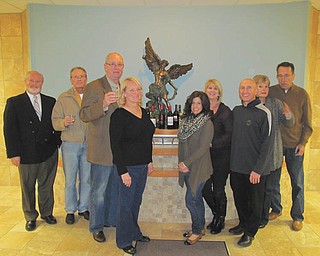St. Michael Church sets benefit wine taste
Members of St. Michael Church Wine Taste Committee pose in front of the statue of the church’s patron saint as they prepare for the seventh annual St. Michael Church Family Life Center Benefit Wine Taste. Among committee members are, from left, Chuck Wirtz, Mike Fagan, Jim and Maxine Gordon, Michelle Billy, Sharon Fischer, Mark Billy and Audrey and Mike Geskey. The event will take place at 7 p.m. April 19 in the Family Life Center, 300 N. Broad St., Canfield. Proceeds will help pay for the center’s mortgage. Tickets are $50 per person and are available from committee members or by calling the church office at 330-533-6839. Wines from northeast Ohio will be paired with food by The Embassy and parishioners Mike and Karen Naffah. There will be auction items and a raffle drawing. SPECIAL TO THE VINDICATOR