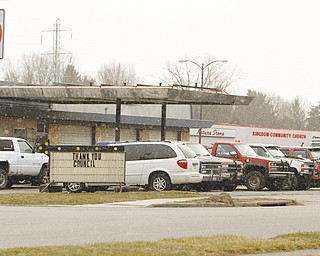 Struthers Mayor Terry P. Stocker has vetoed a resolution that would honor the owner of Charlie’s Service Station, above, located in front of the Struthers Plaza on Fifth Street. Stocker said the business is an eyesore to the community because of the dilapidated vehicles parked around it.