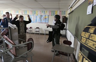 ROBERT K. YOSAY | THE VINDICATOR..Officers empty a classroom after student barricaded themselves in the room - ..BPD and area law enforcement had a mock drill of a shooter at Boardman High School - .. - -30-..