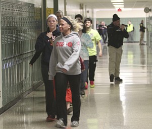 ROBERT K. YOSAY | THE VINDICATOR..Students are escorted out of the building after the two intruders had been apprehended.. but still under the watchful eye of the force - BPD and area law enforcement had a mock drill of a shooter at Boardman High School - .. - -30-..
