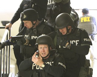 ROBERT K. YOSAY | THE VINDICATOR..Sgt Mike Hughes and Sgt Glen RIddle directly behind to the left come down a stairwell as they look for a possible shooter at BHS..BPD and area law enforcement had a mock drill of a shooter at Boardman High School - .. - -30-..