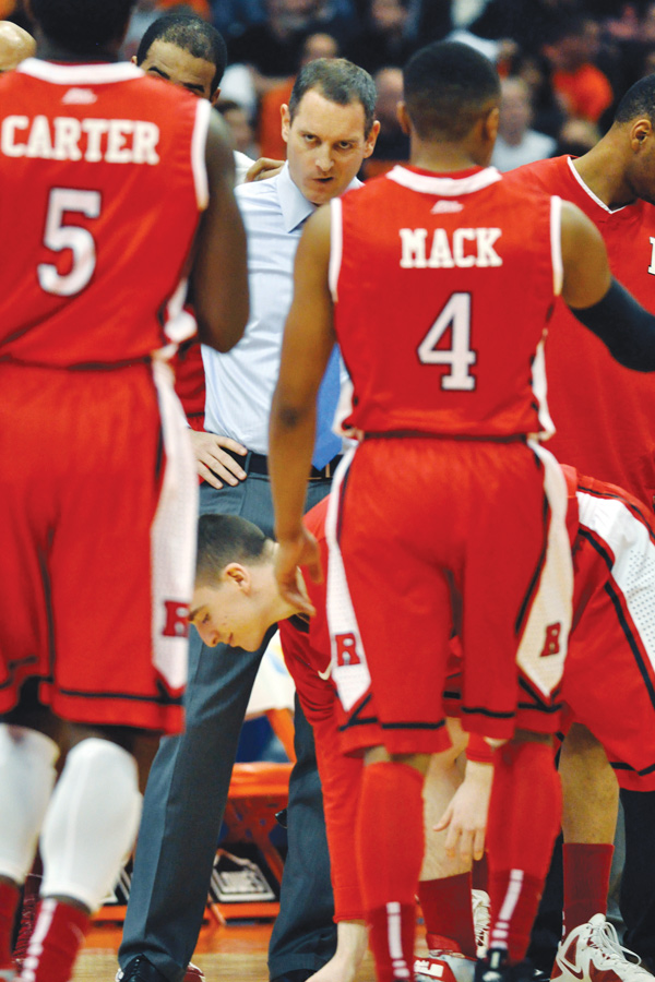 Rutgers head coach Mike Rice glares at his players during a timeout at a game against Syracuse. Rice, a Boardman graduate, was fired by the university Wednesday after a videotape aired showing Rice using gay slurs, shoving and grabbing his players and throwing balls at them in practice.