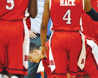 Rutgers head coach Mike Rice glares at his players during a timeout at a game against Syracuse. Rice, a Boardman graduate, was fired by the university Wednesday after a videotape aired showing Rice using gay slurs, shoving and grabbing his players and throwing balls at them in practice.