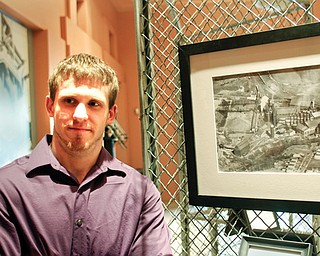 Clayton Ruminski, a YSU graduate student studying history, is hosting a photo exhibit at the Youngstown
Historical Center of Industry and Labor titled “Iron Valley: A Century of Change at the Hubbard Furnace.”