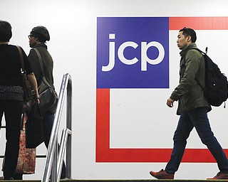 Customers arrive at a J.C. Penney store Tuesday in New York. J.C. Penney is hoping its former CEO can revive the retailer after a risky turnaround strategy backfired.