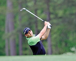 Spain’s Sergio Garcia hits his tee shot to the 12th green Thursday during the first round of The Masters at Augusta National Golf Club in Augusta, Ga. Garcia matched his best Masters score — a 6-under 66 —to surge up the leaderboard and into a two-way tie for first place with Australia’s Marc Leishman.