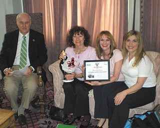 SPECIAL TO THE VINDICATOR
The Rotary Club of Youngstown is preparing for its 14th annual reverse raffle and silent auction fundraiser April 26 at the Embassy in Youngstown. Admiring some of the gifts donated to the auction are, from left, Bill Petro, Linda Kostka and Elanye Bozick, committee members, and Debbie Esbenshade,
raffle chairwoman.