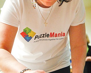 Several thousand puzzle pieces were used during Autism Society of Ohio’s Puzzlemania at the OH WOW! Children’s Center in downtown Youngstown. The puzzle-building competition Sunday was designed to raise awareness about autism during Autism Awareness Month. Proceeds benefited educational and support programs for the organization.