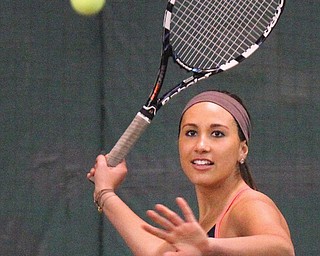 Warren JFK tennis player Danielle Covelli eyes a shot against Salem during a match on Friday at the Salem Racquet Club. Covelli is a four-year starter and two-time captain on the Eagles’ boys tennis team.